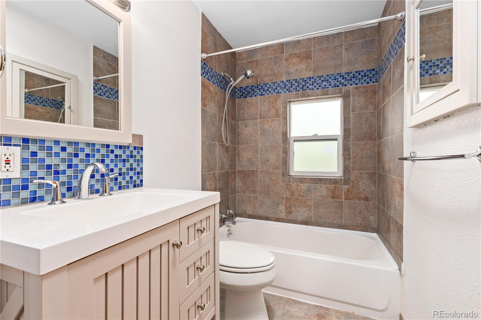 29723 Spruce Road Evergreen, CO 80439 - Photo 27 of 42 a bathroom with a sink a toilet and a bathtub