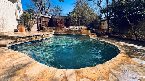 a view of a swimming pool with a patio