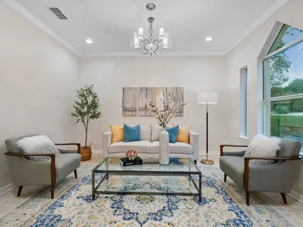 a view of a dining room with furniture window and outside view