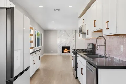 a spacious bedroom with a bed and a couch