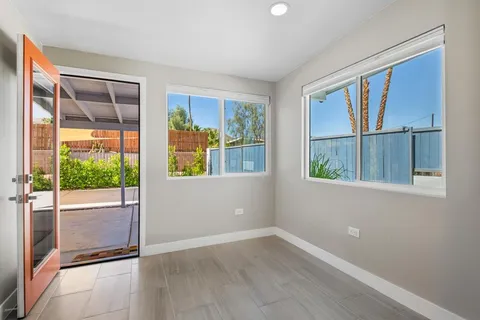 a bathroom with a granite countertop sink a toilet and shower