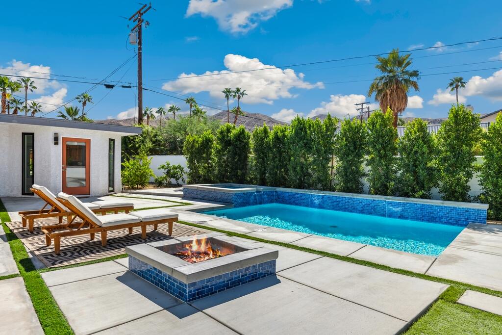 38855 Paradise Way Cathedral City, CA 92234 - Photo 2 of 67 a view of a chairs and table in a patio with a swimming pool