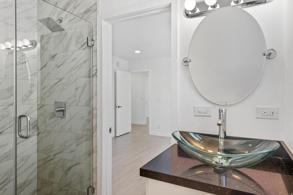 38855 Paradise Way Cathedral City, CA 92234 - Photo 28 of 67 a bathroom with a sink and a mirror