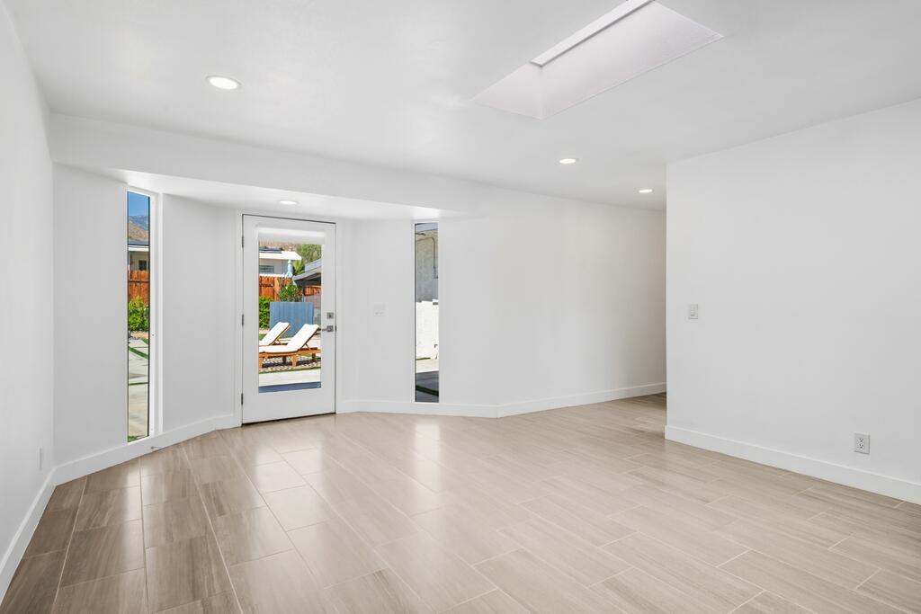 38855 Paradise Way Cathedral City, CA 92234 - Photo 39 of 67 wooden floor in an empty room with a window