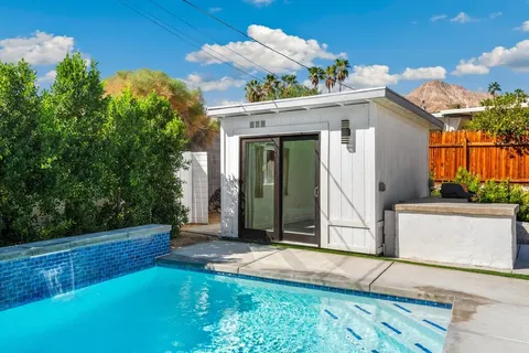 an aerial view of a house with a mountain view