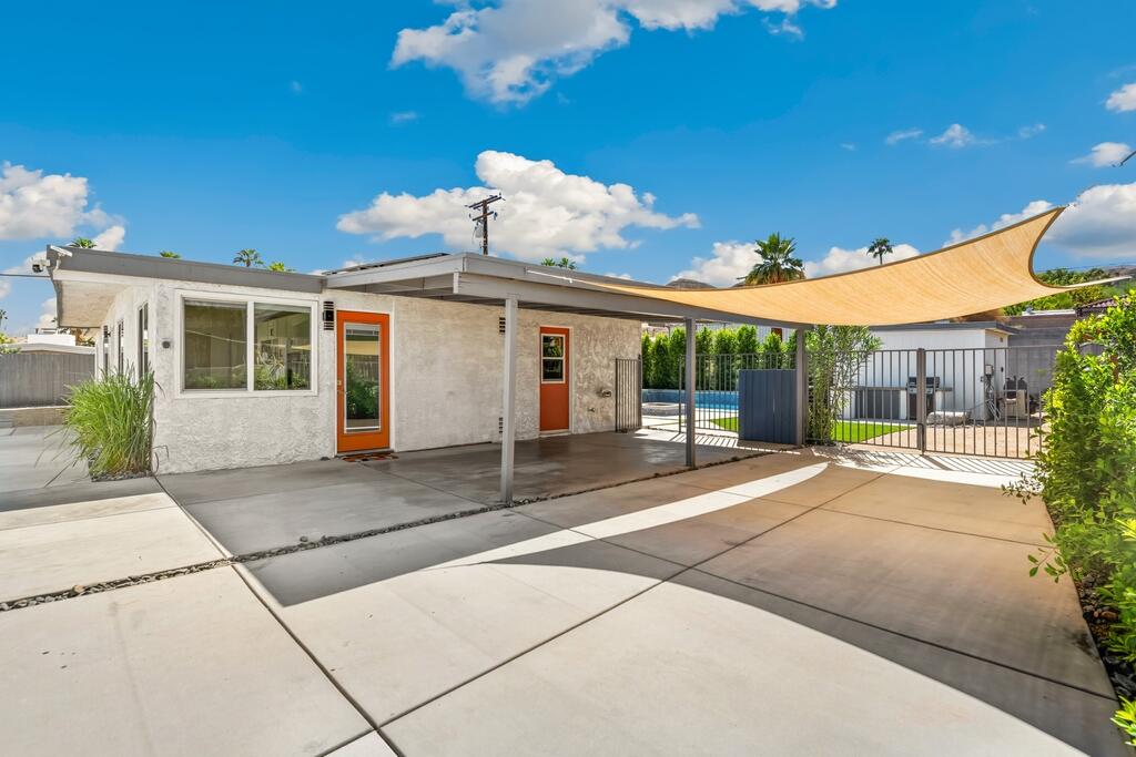 38855 Paradise Way Cathedral City, CA 92234 - Photo 53 of 67 a view of a house with a backyard and a garage