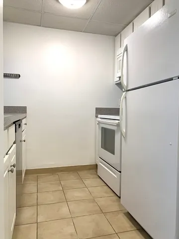 a view of a storage and utility room with washer and dryer