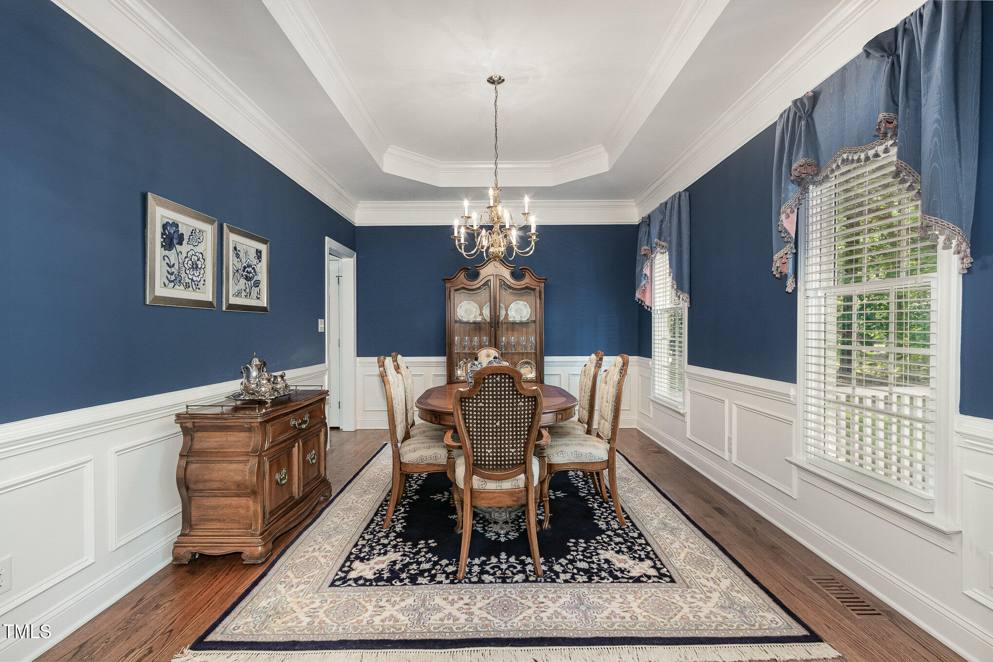 8304 Epping Forest Way Wake Forest, NC 27587 - Photo 11 of 41 a dining room with chandelier and wooden floor