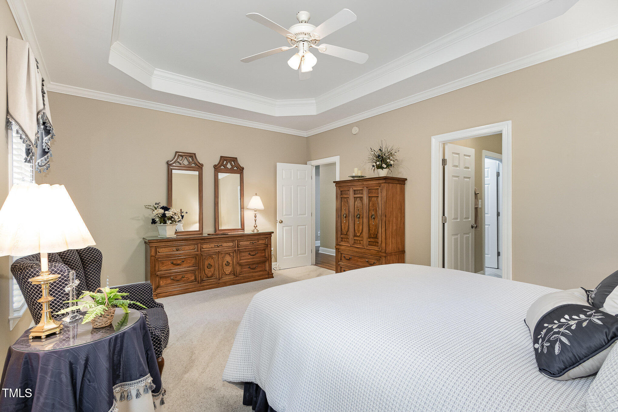 8304 Epping Forest Way Wake Forest, NC 27587 - Photo 21 of 41 a spacious bedroom with a bed and ceiling fan