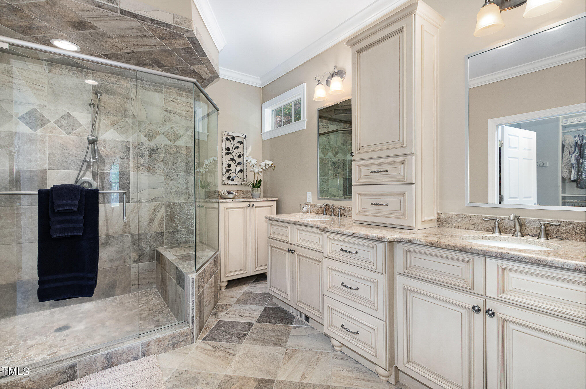 8304 Epping Forest Way Wake Forest, NC 27587 - Photo 22 of 41 a bathroom with a double vanity sink mirror and shower