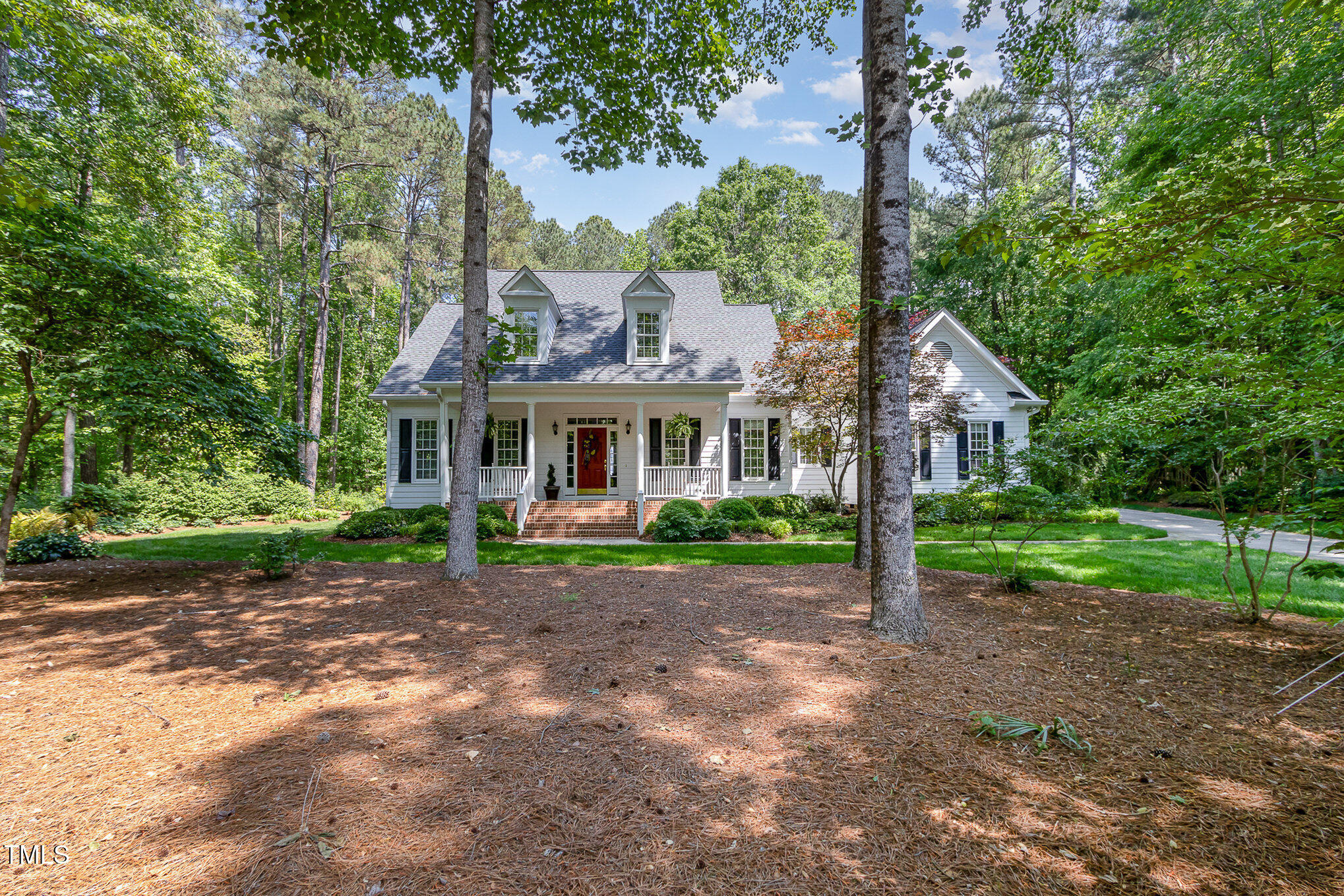 8304 Epping Forest Way Wake Forest, NC 27587 - Photo 3 of 41 a front view of a house with garden