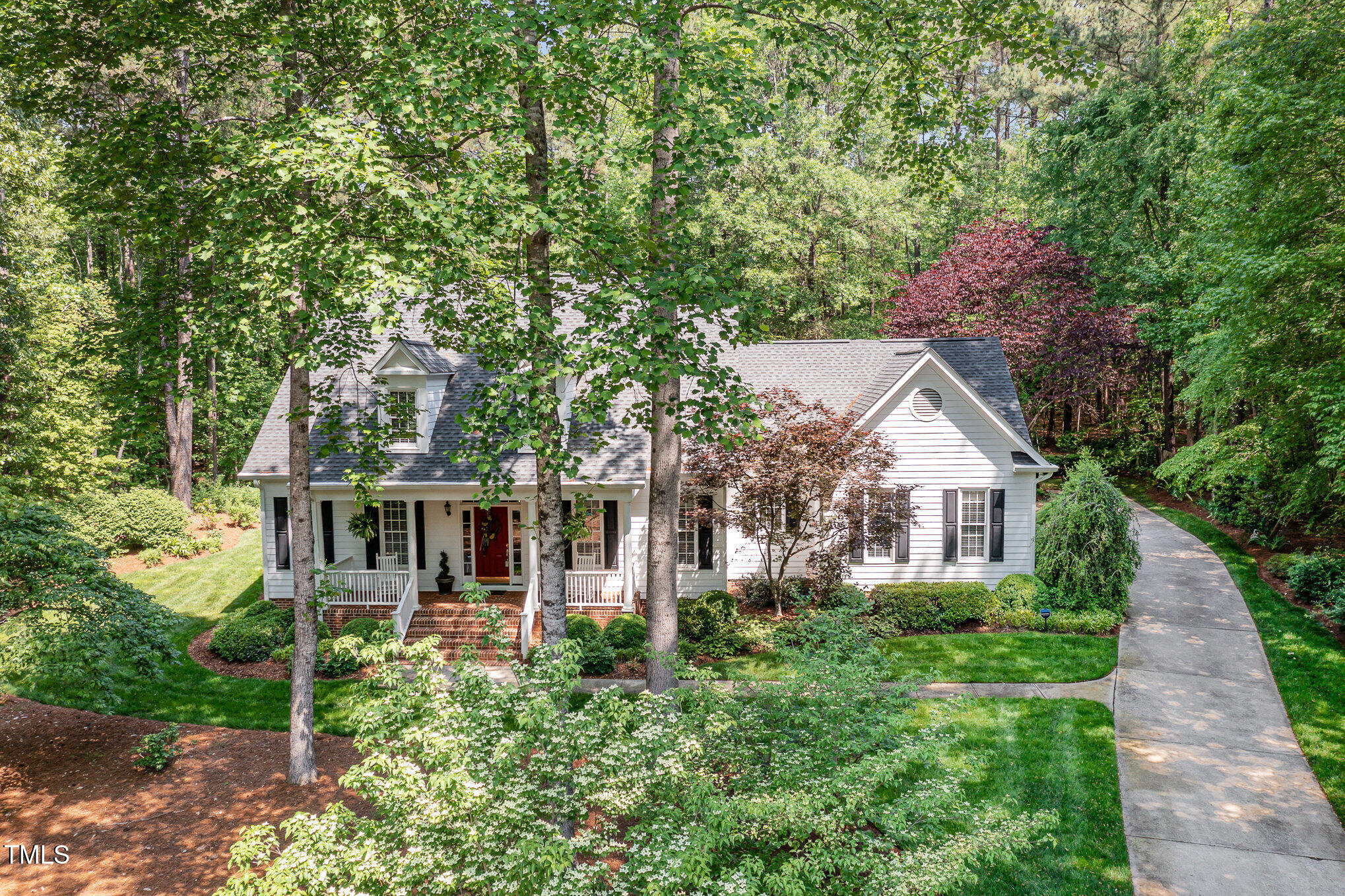 8304 Epping Forest Way Wake Forest, NC 27587 - Photo 4 of 41 front view of a house with a garden