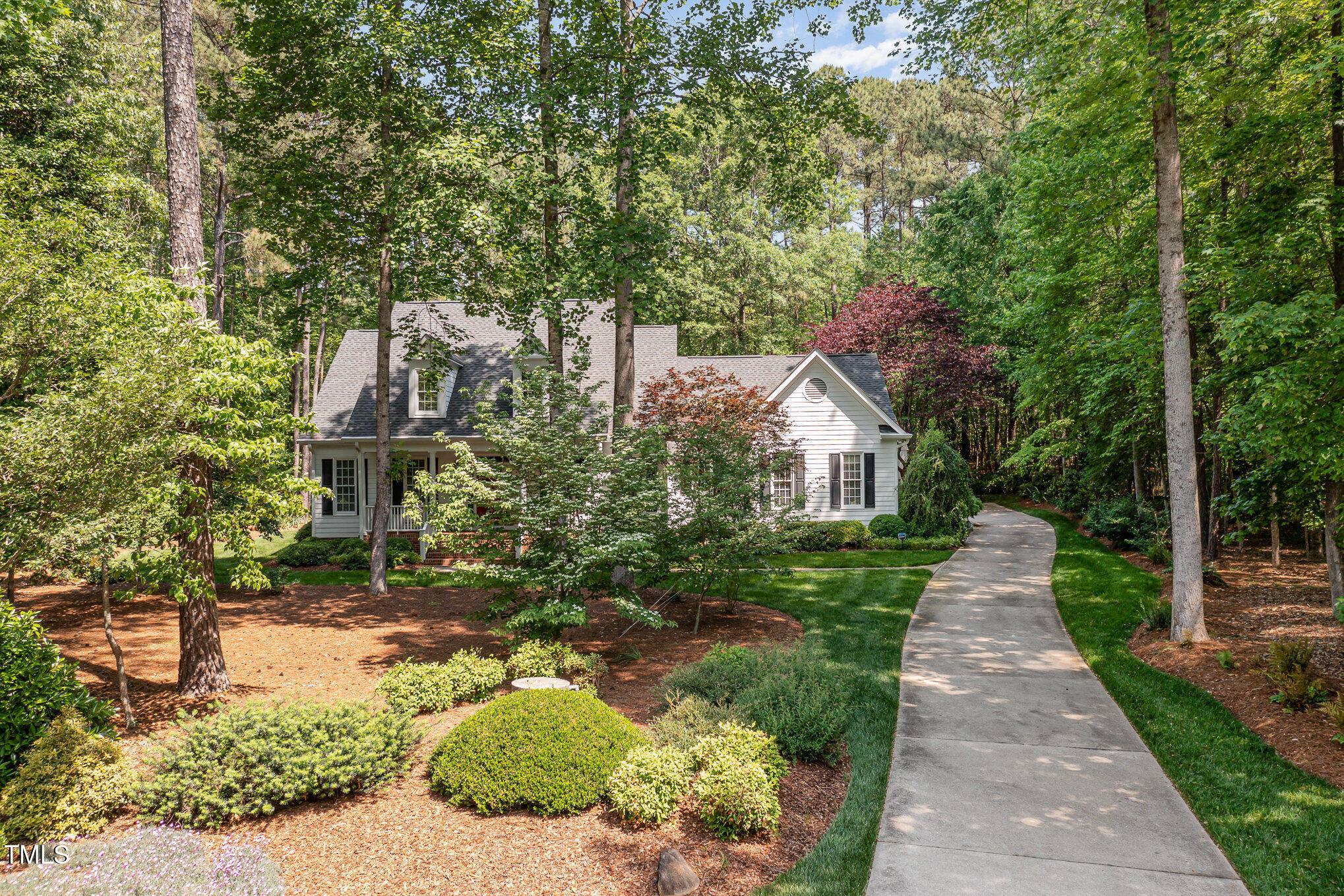 8304 Epping Forest Way Wake Forest, NC 27587 - Photo 6 of 41 a front view of a house with a yard and trees