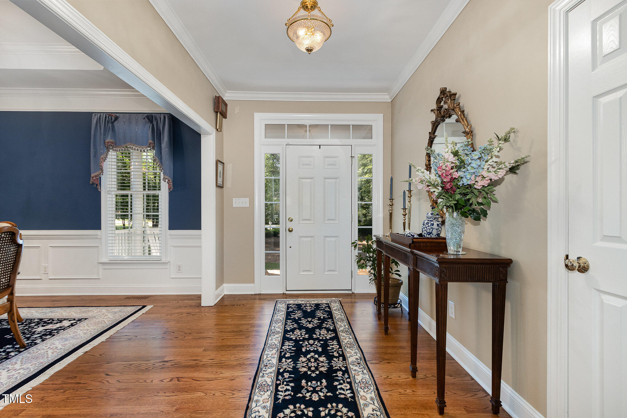 8304 Epping Forest Way Wake Forest, NC 27587 - Photo 8 of 41 a view of a entryway door of the house and wooden floor