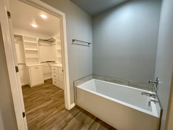 a bathroom with a bathtub and a shower