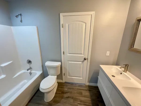 a bathroom with a sink toilet and bathtub
