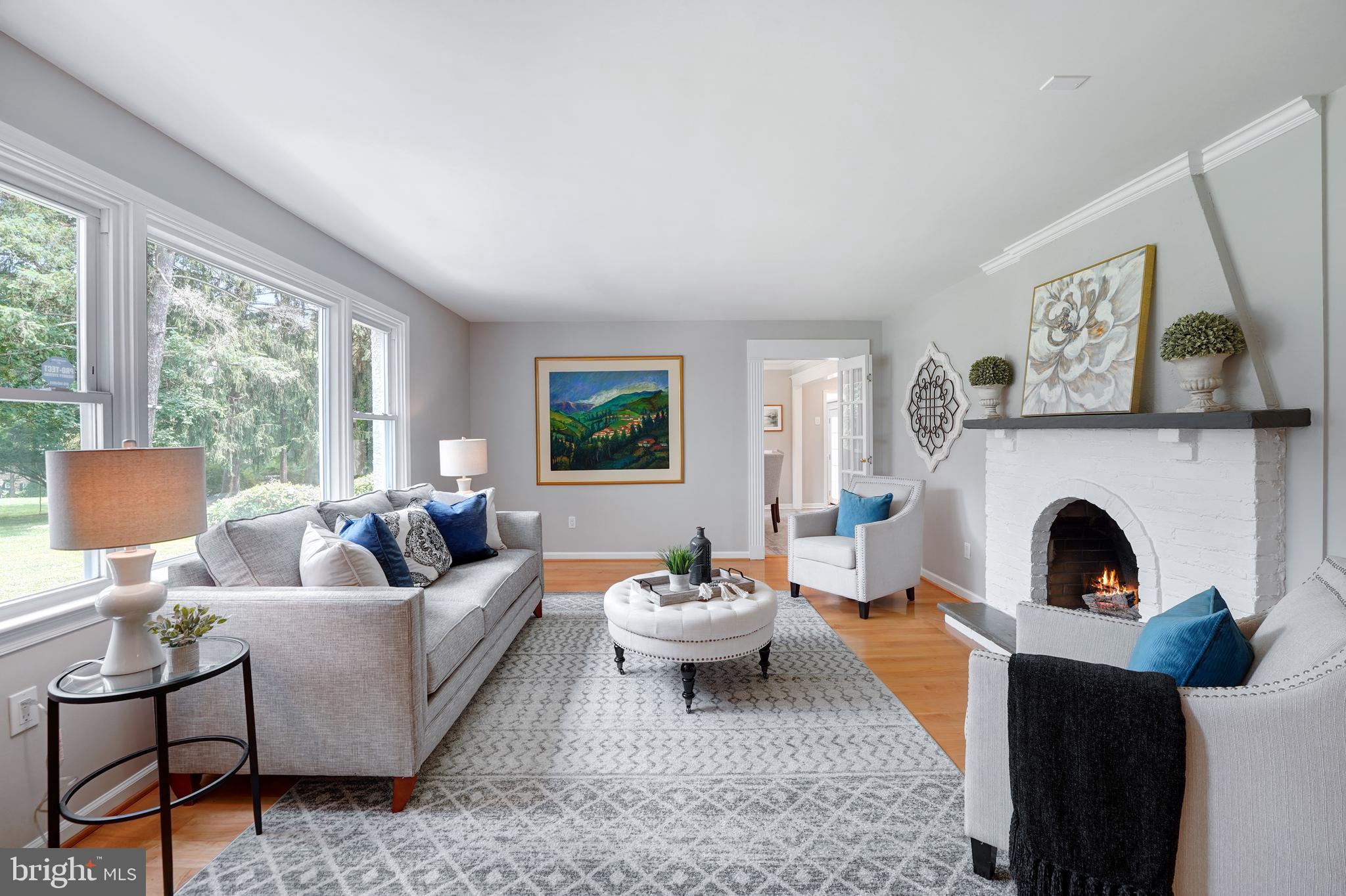 922 Hunt Road Radnor, PA 19008 - Photo 12 of 59 a living room with furniture and a fireplace