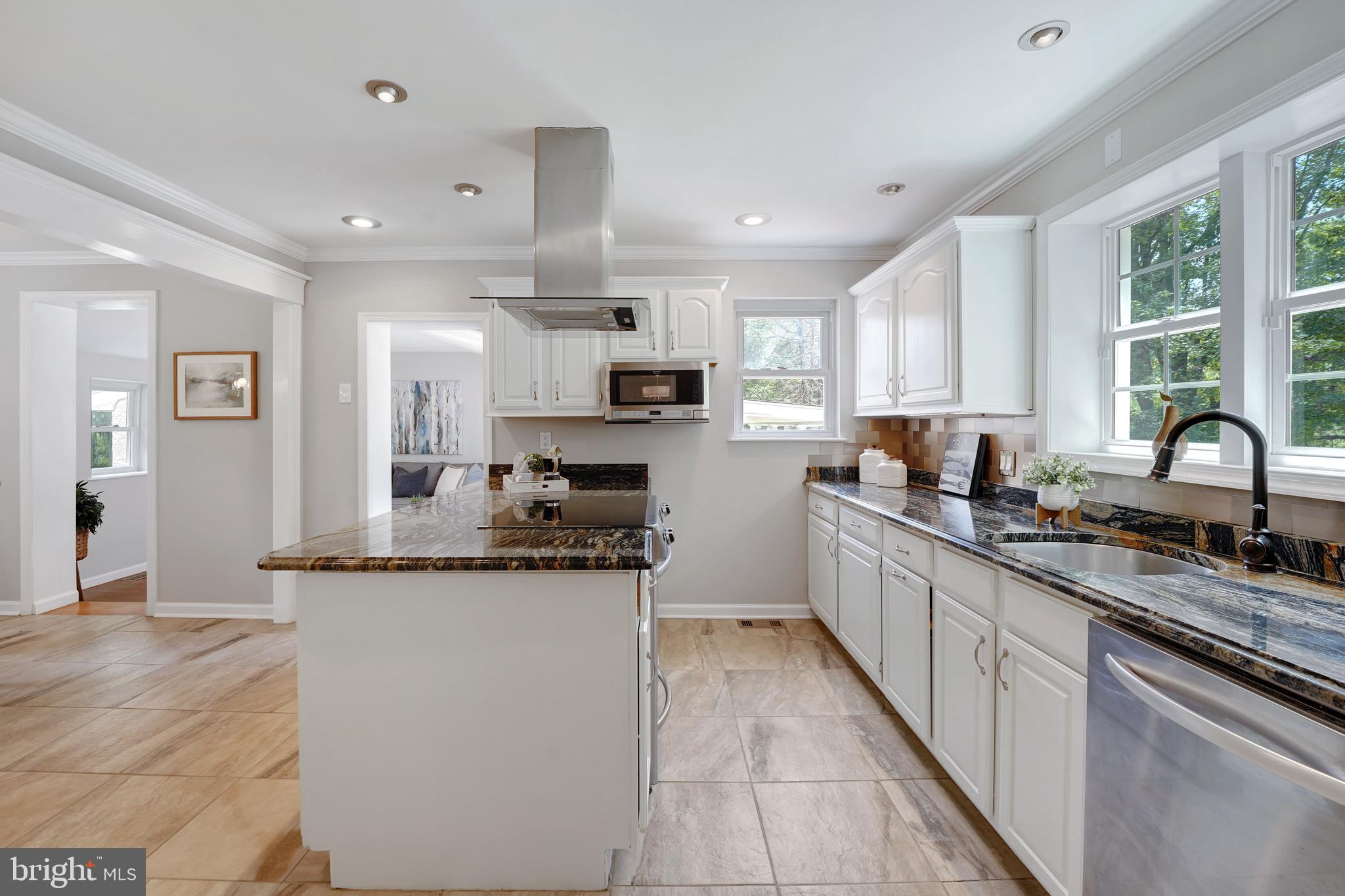 922 Hunt Road Radnor, PA 19008 - Photo 17 of 59 a kitchen with stainless steel appliances granite countertop a sink stove and cabinets