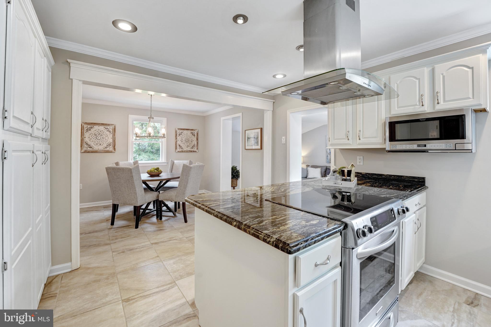 922 Hunt Road Radnor, PA 19008 - Photo 20 of 59 a kitchen with stainless steel appliances granite countertop a stove and a sink