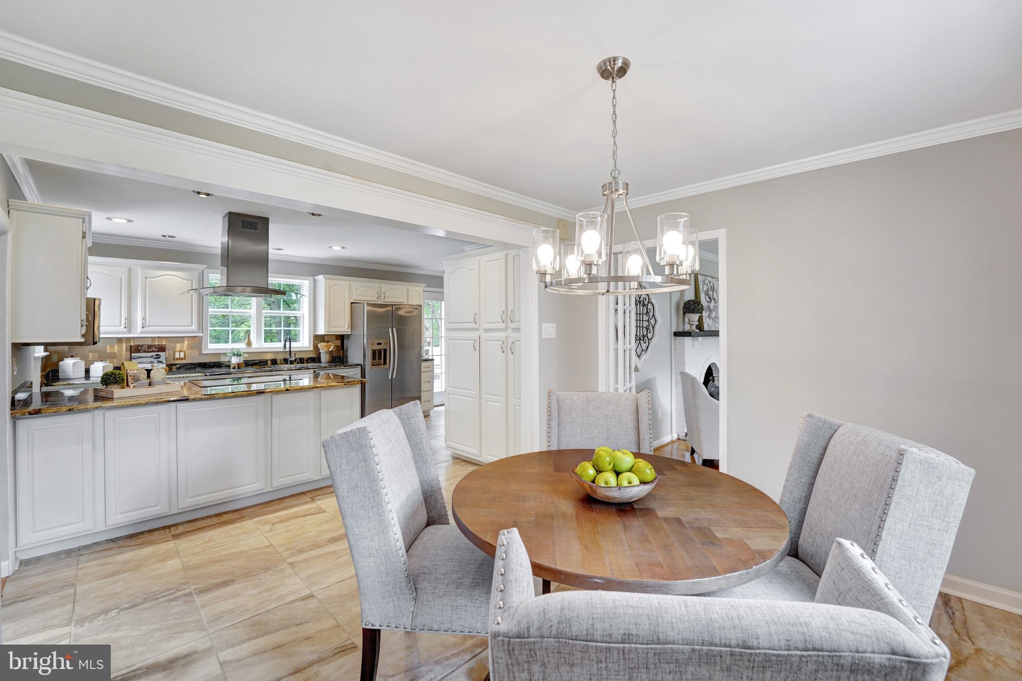 922 Hunt Road Radnor, PA 19008 - Photo 24 of 59 a view of a dining room with furniture and chandelier