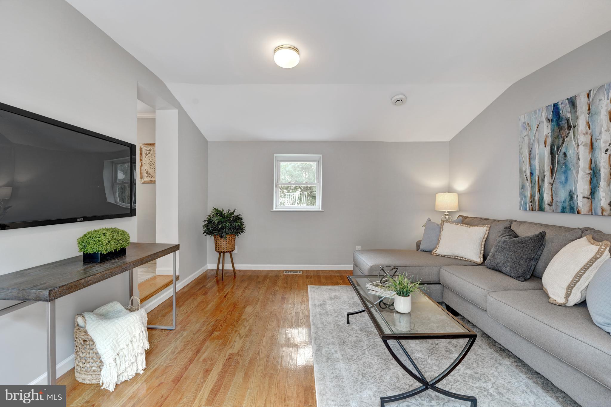 922 Hunt Road Radnor, PA 19008 - Photo 25 of 59 a living room with furniture and a flat screen tv