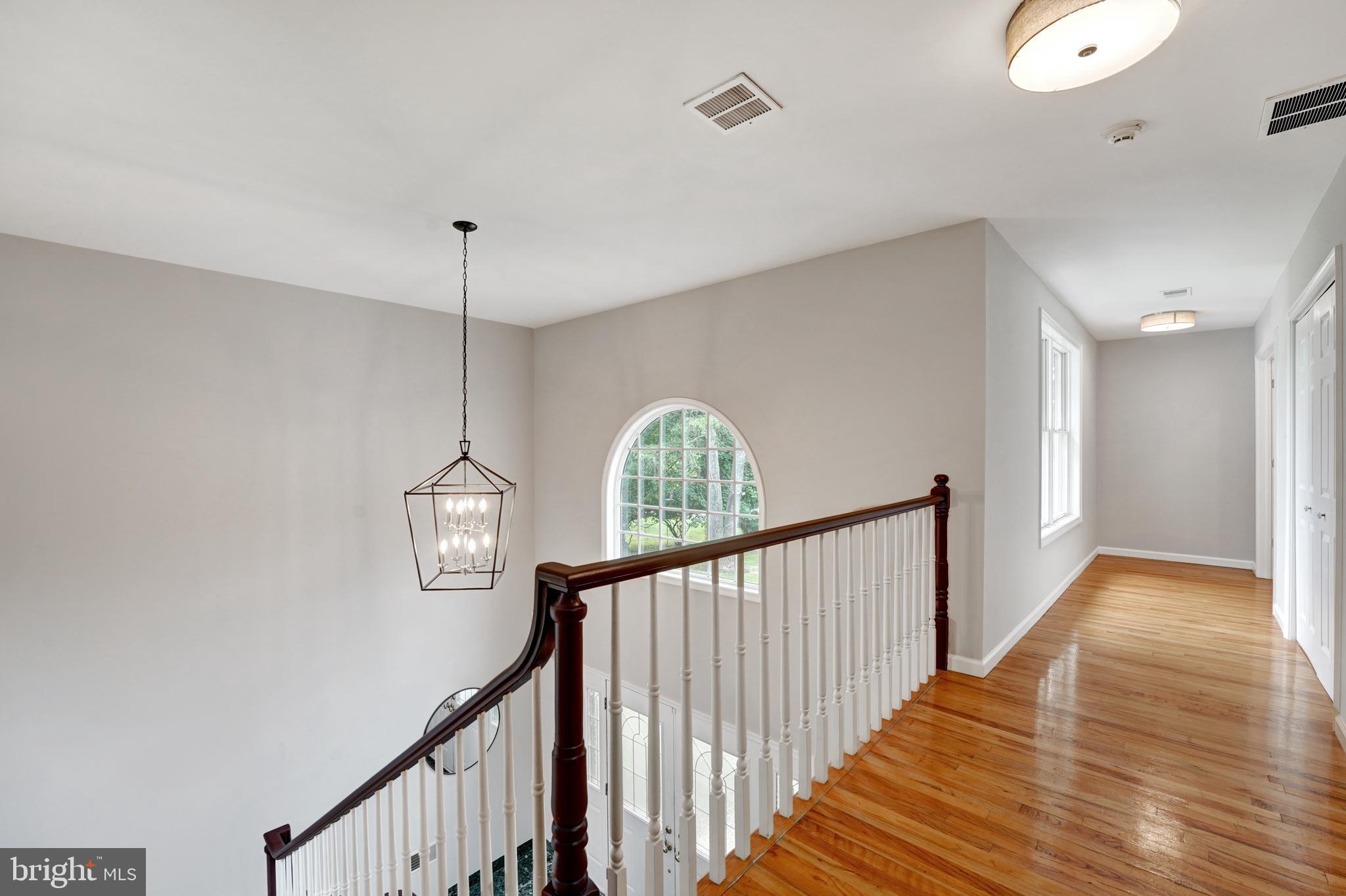 922 Hunt Road Radnor, PA 19008 - Photo 31 of 59 a view of staircase with railing and chandelier