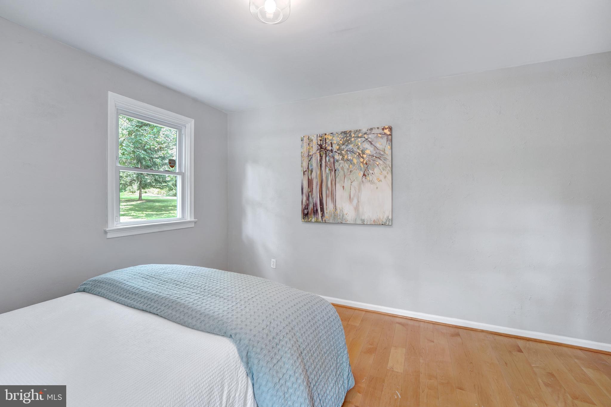 922 Hunt Road Radnor, PA 19008 - Photo 38 of 59 a bedroom with a bed and a window