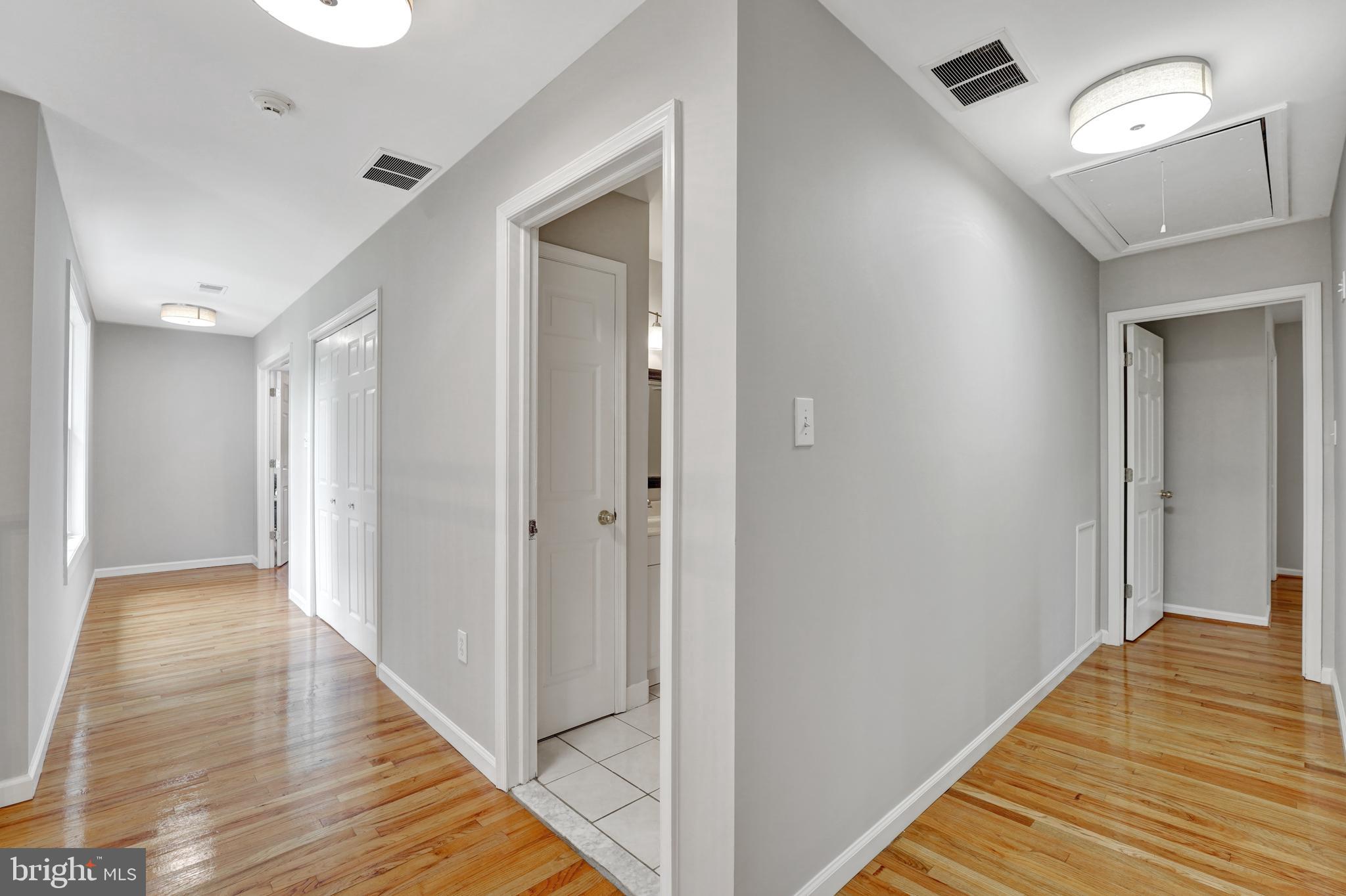 922 Hunt Road Radnor, PA 19008 - Photo 39 of 59 a view of a hallway with wooden floor