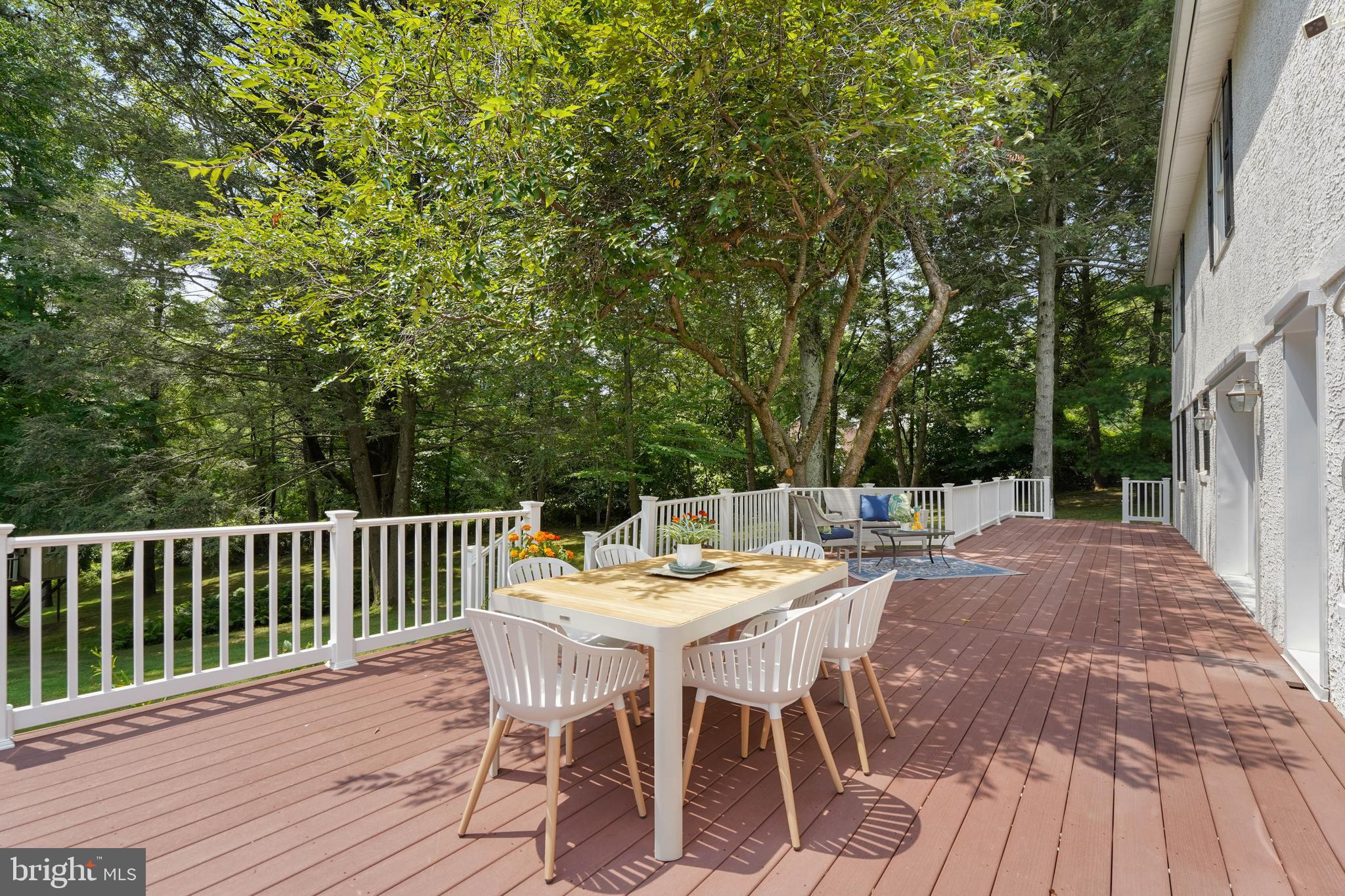 922 Hunt Road Radnor, PA 19008 - Photo 47 of 59 a view of a patio with a table and chairs