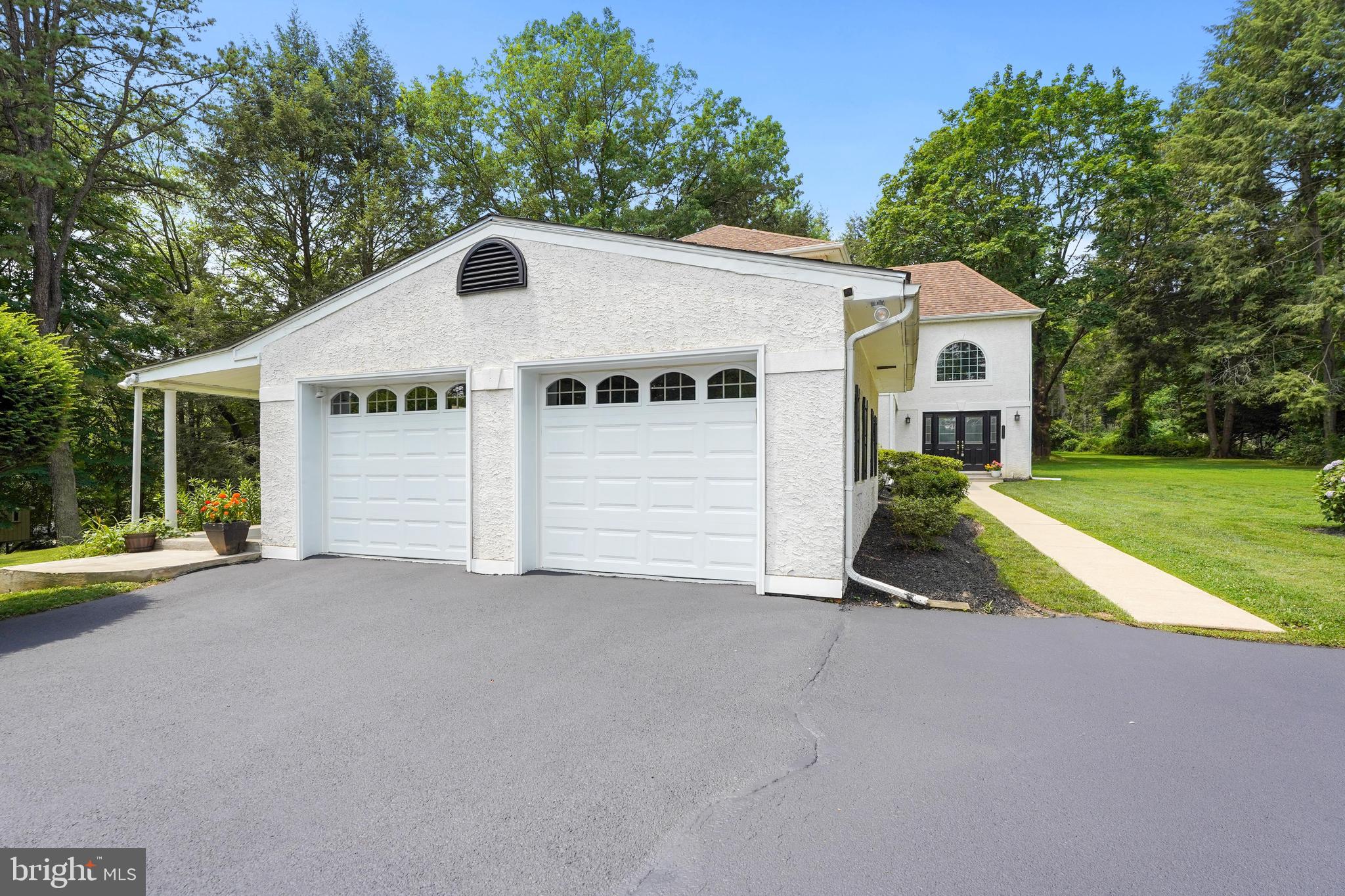 922 Hunt Road Radnor, PA 19008 - Photo 53 of 59 a view of a house with a yard and a large tree