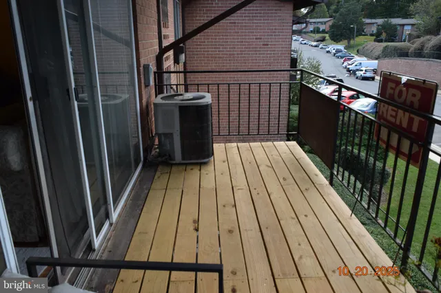 a view of balcony with wooden floor