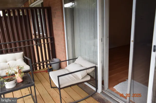 a view of a balcony with chairs