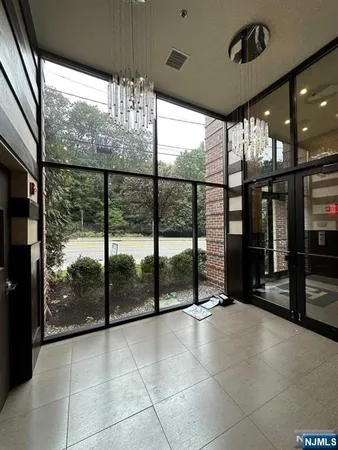 a view of an entryway with a floor to ceiling window