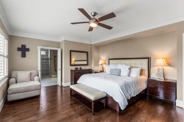 a bedroom with a bed and a couch