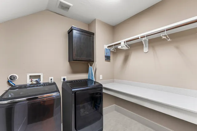 a utility room with washer and dryer