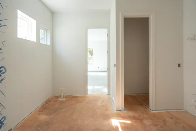 an empty room with closet area