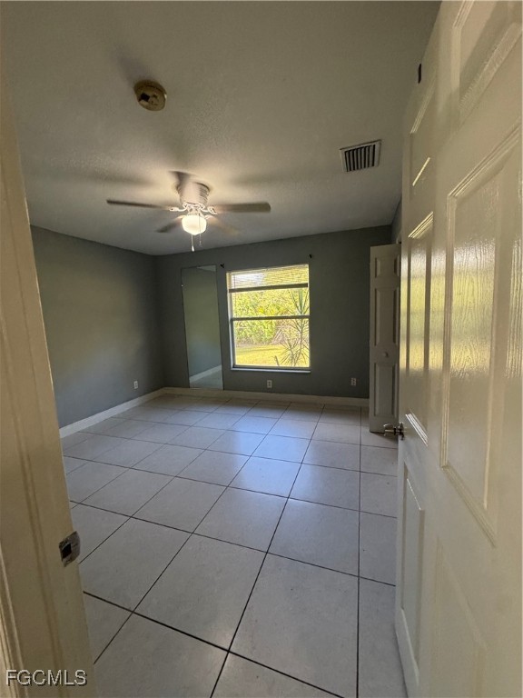 291 16th Street Northeast, Unit 1 Naples, FL 34120 - Photo 12 of 21 a view of an empty room with a window