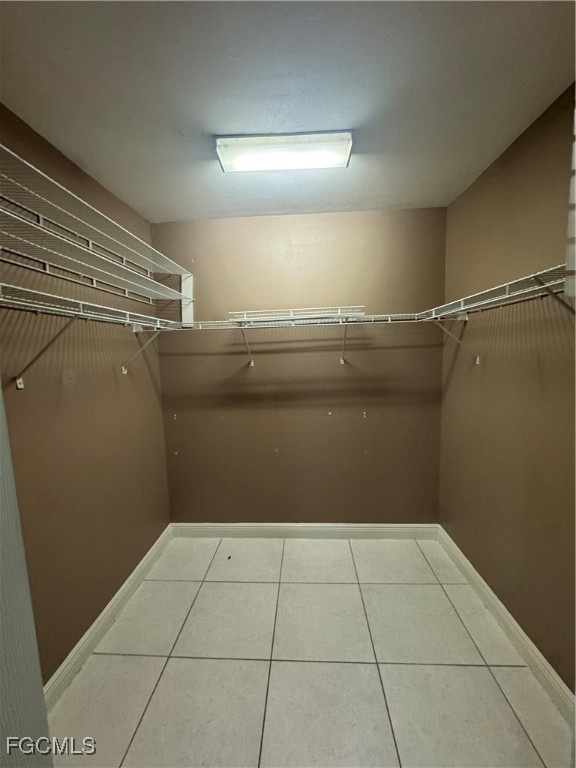 291 16th Street Northeast, Unit 1 Naples, FL 34120 - Photo 15 of 21 a view of storage and utility room with racks on the wall