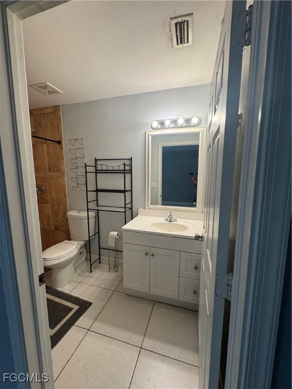291 16th Street Northeast, Unit 1 Naples, FL 34120 - Photo 16 of 21 a bathroom with a tub sink and mirror