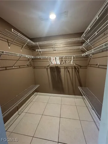 a large white kitchen with a stove a sink dishwasher and a refrigerator