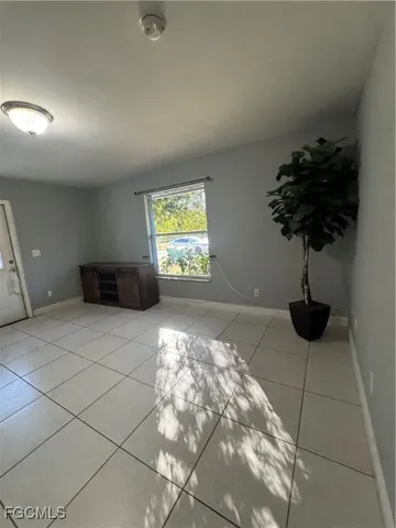 a white kitchen with a sink stainless steel appliances and cabinets