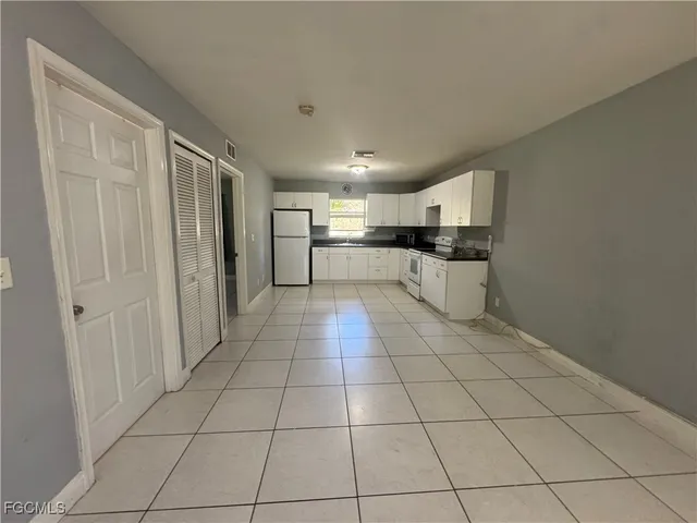 a view of an empty room and a window