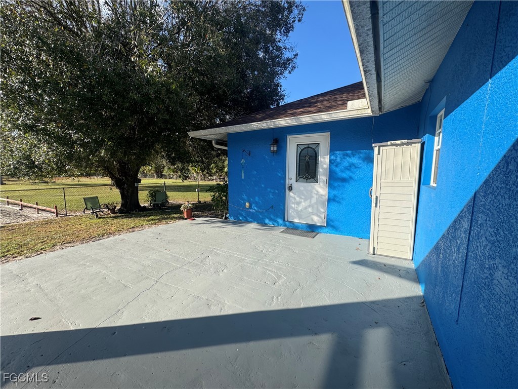 291 16th Street Northeast, Unit 1 Naples, FL 34120 - Photo 8 of 21 a view of back yard of the house