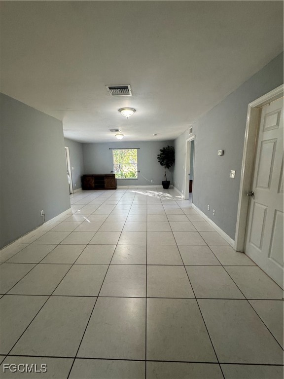291 16th Street Northeast, Unit 1 Naples, FL 34120 - Photo 10 of 21 a view of an empty room and a window
