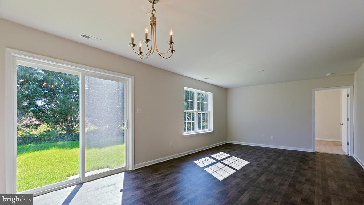 101 Whitman Lane Woodbine, NJ 08270 - Photo 12 of 29 a very nice looking room with a big bed and a chandelier