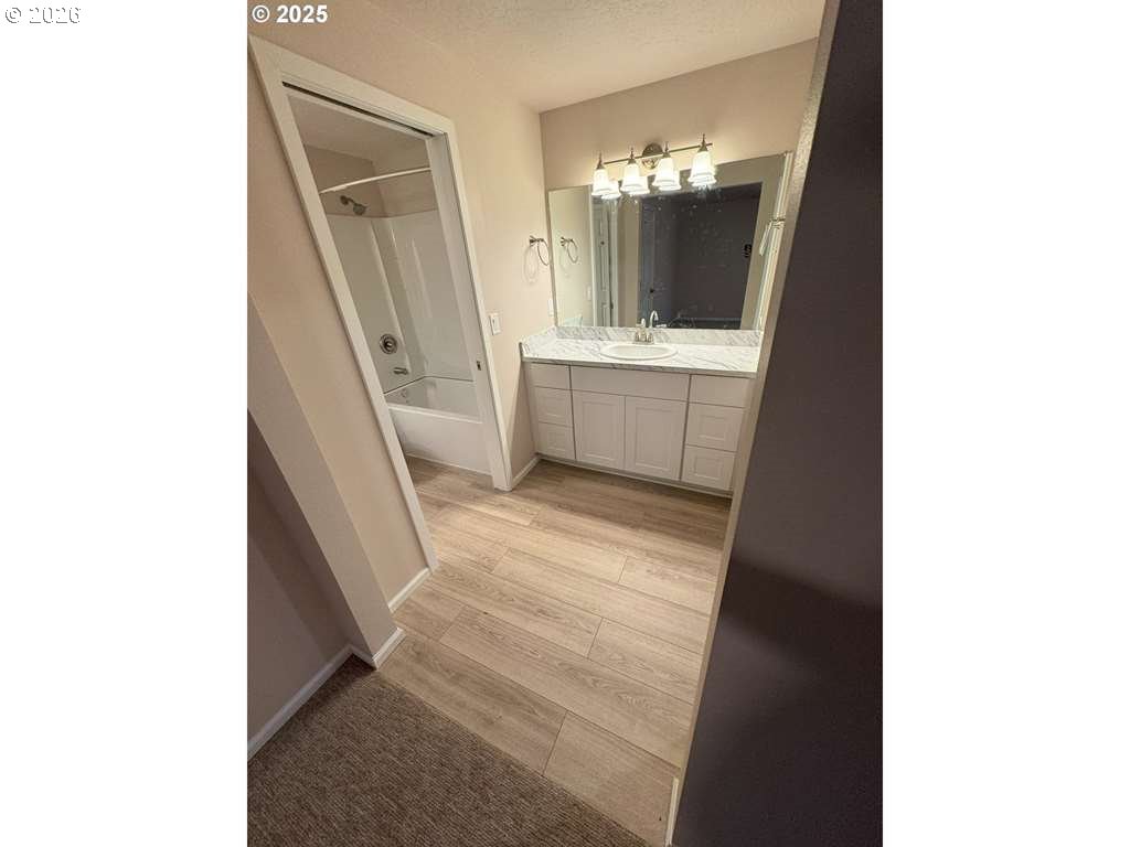 529 Helen Street Eugene, OR 97404 - Photo 6 of 9 a bathroom with a sink and a mirror
