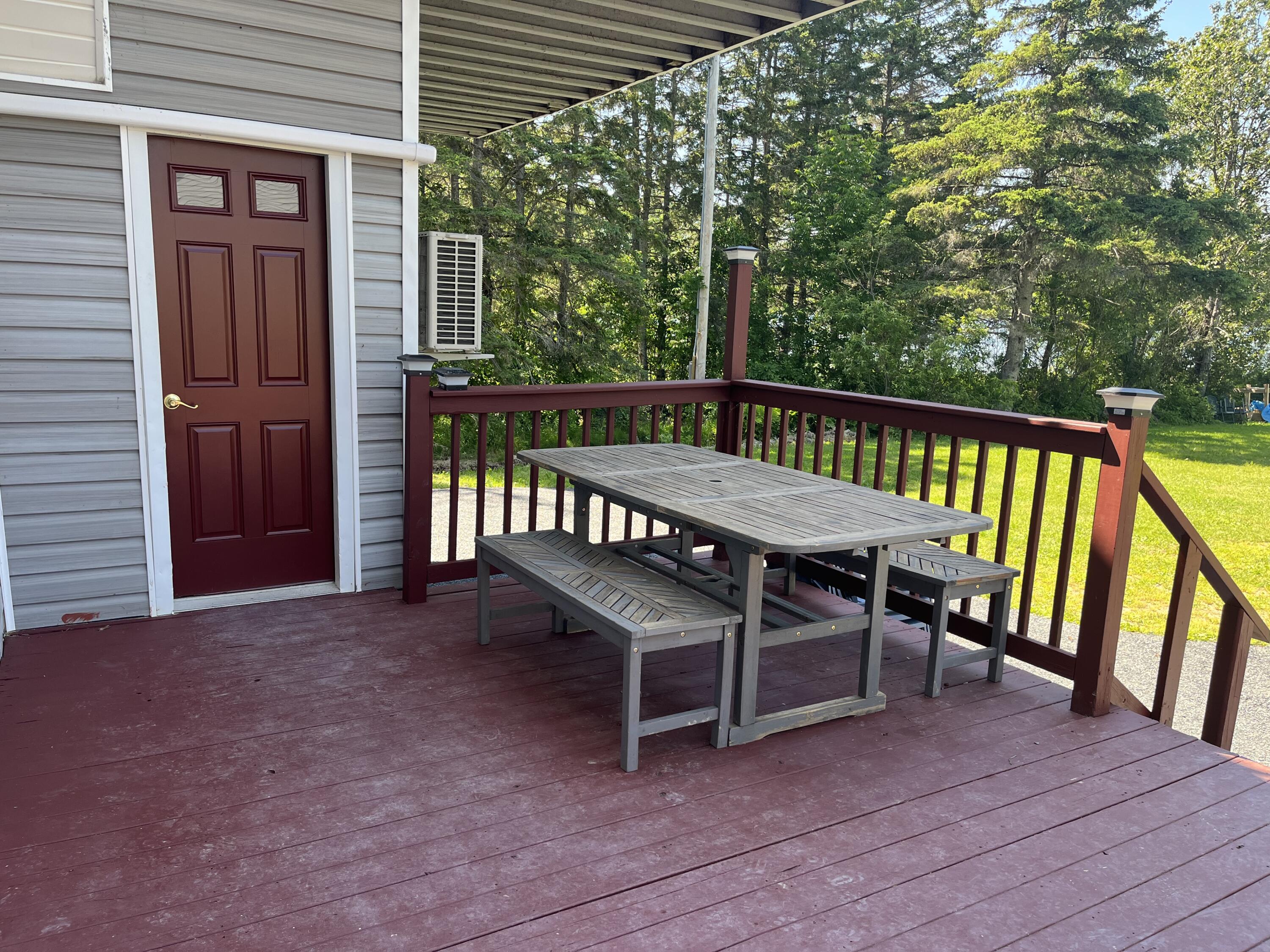 10 Island Road St. Agatha, ME 04772 - Photo 28 of 41 Deck with entry to garage and guest spac