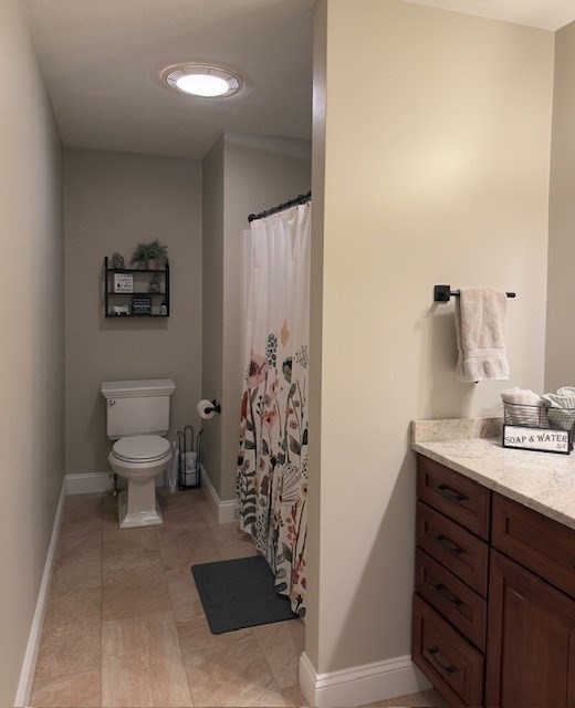 5 Deer Hill Road Oxford, MA 01537 - Photo 20 of 37 a bathroom with a toilet sink and mirror