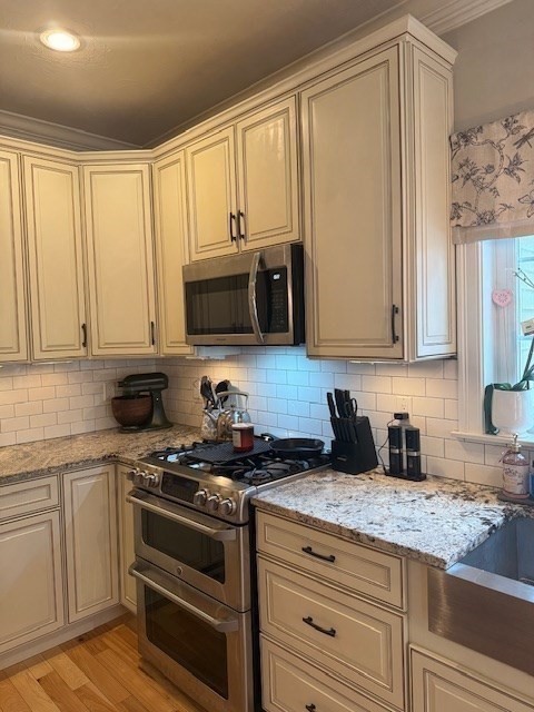 5 Deer Hill Road Oxford, MA 01537 - Photo 4 of 37 a kitchen with granite countertop white cabinets and stainless steel appliances