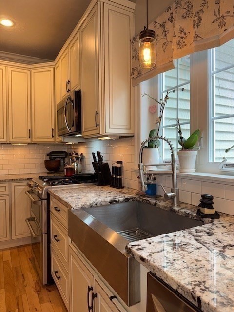 5 Deer Hill Road Oxford, MA 01537 - Photo 5 of 37 a kitchen with a stove a sink and a microwave